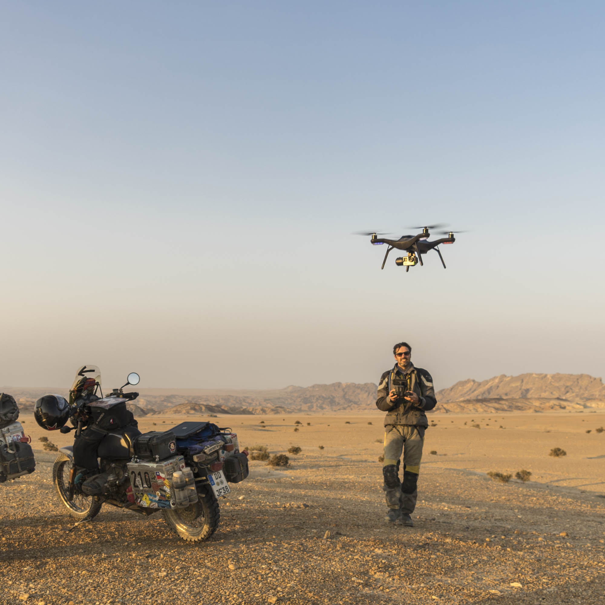 Daniel Rintz operating a camera drone for landscape photography in the desert of Namibia